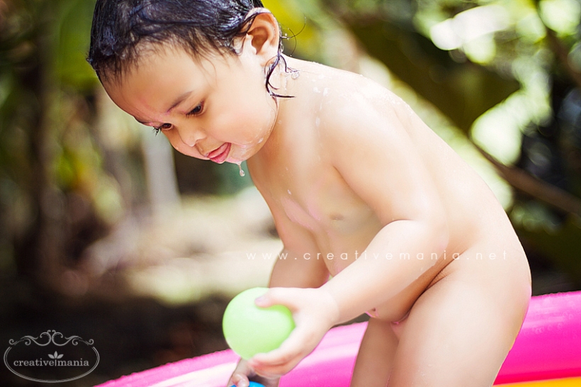 Baby Bathing in Rubber Pool